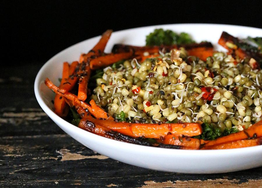 side view close-up of vegan Mung Bean Sprouts Salad with Seared Carrots, kale and Chile Lime Sesame Dressing