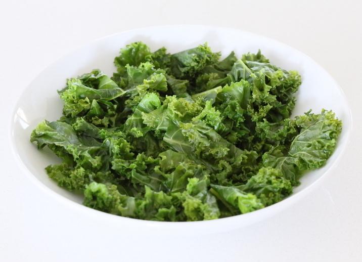 massaged kale in a small white bowl