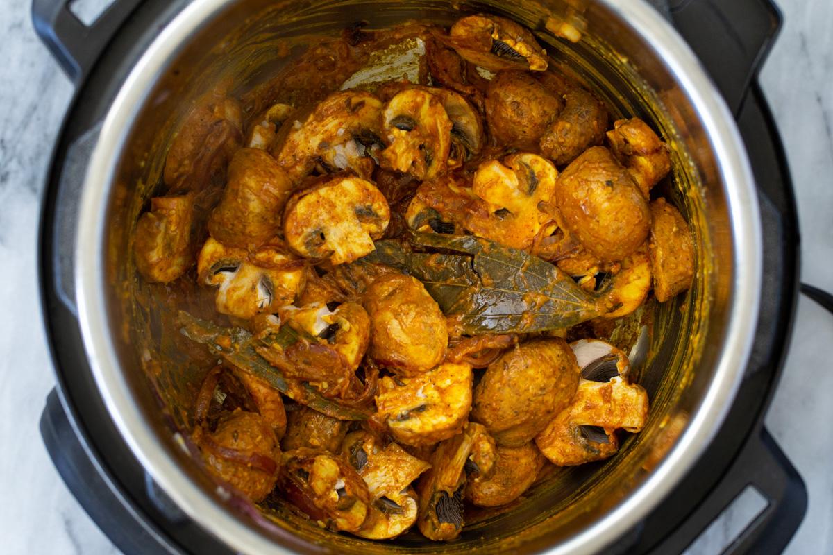 sliced mushrooms tossed in Indian gravy in an Instant Pot