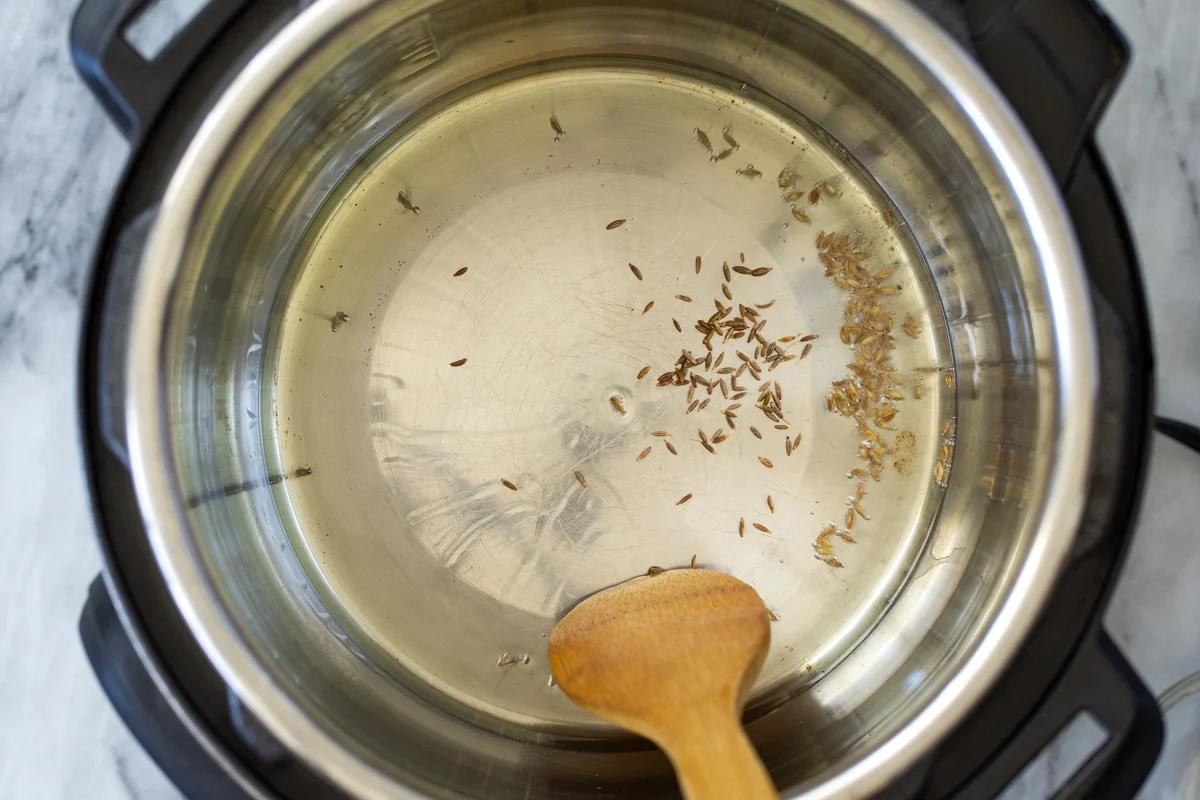 cumin seeds tempering in an Instant Pot