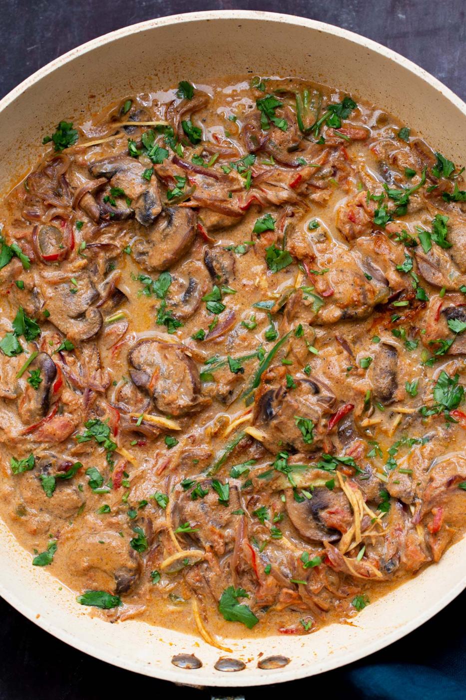 a sauteeing pan with vegan mushroom patiala in creamy gravy
