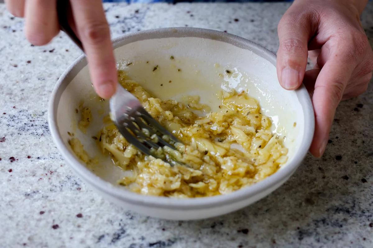 mashing the roasted garlic butter