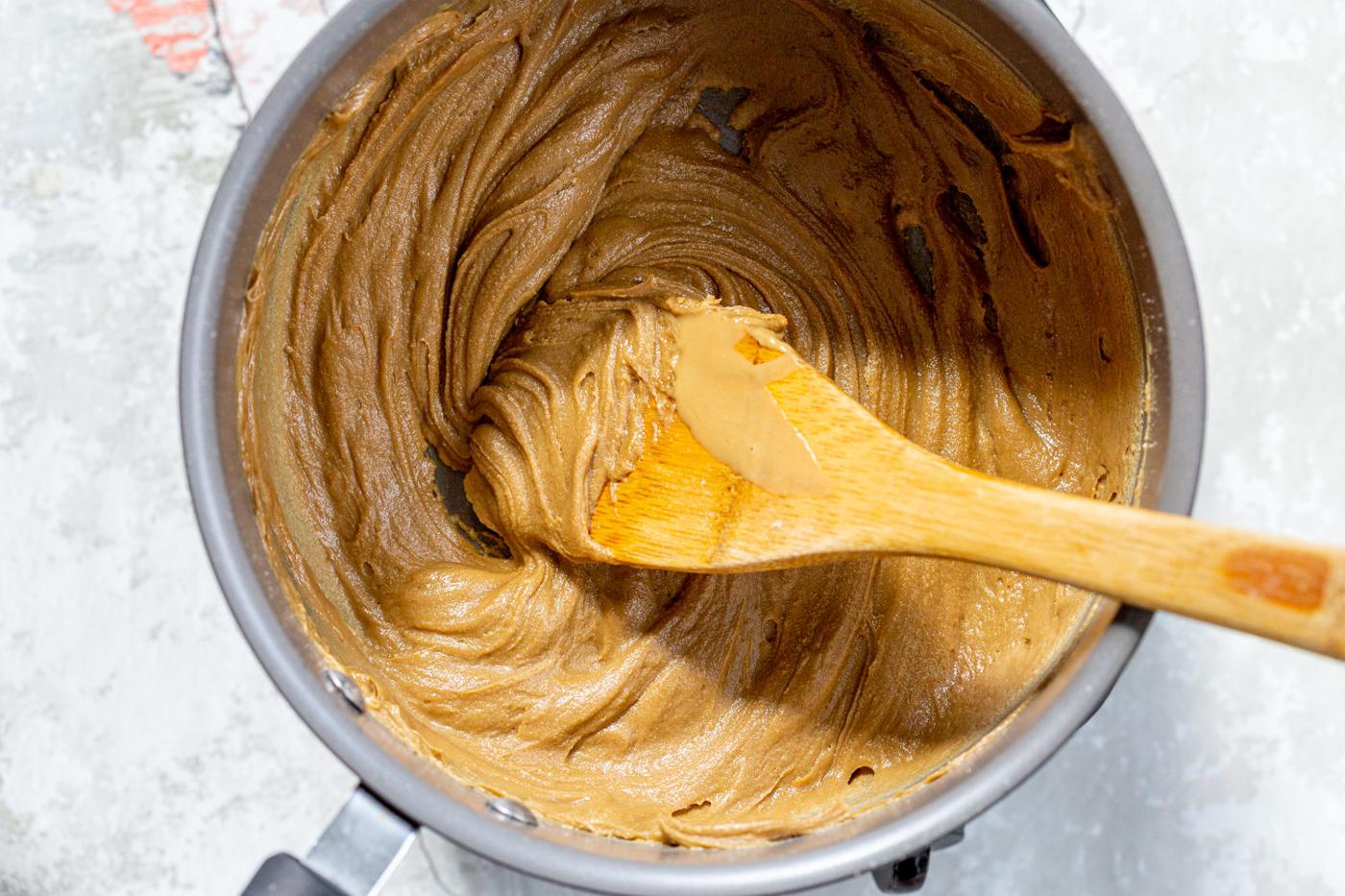 Sunbutter and maple syrup in a saucepan for our Sunbutter Granola Bars