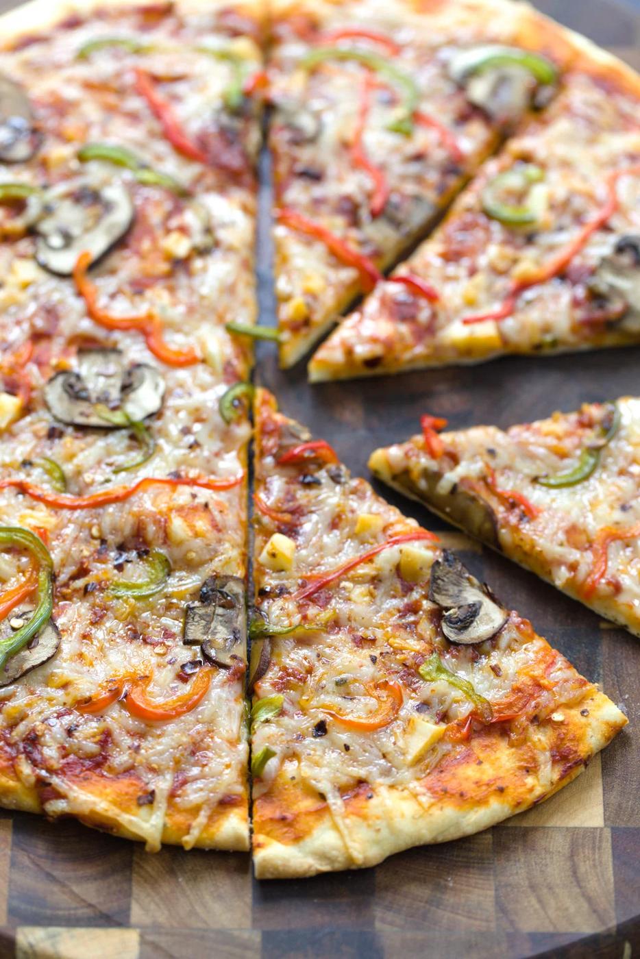 a no yeast vegan pizza cut into slices