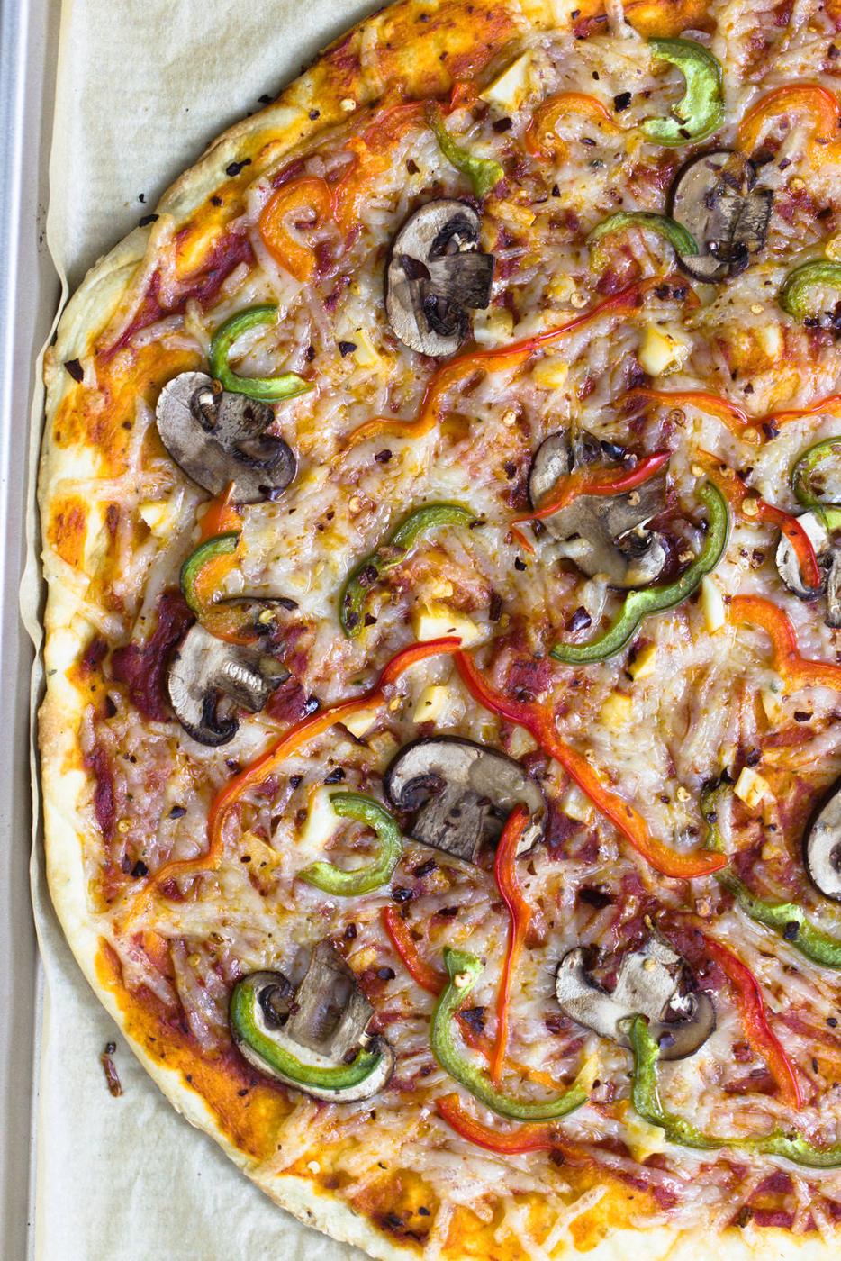 overhead shot of half a vegan pizza