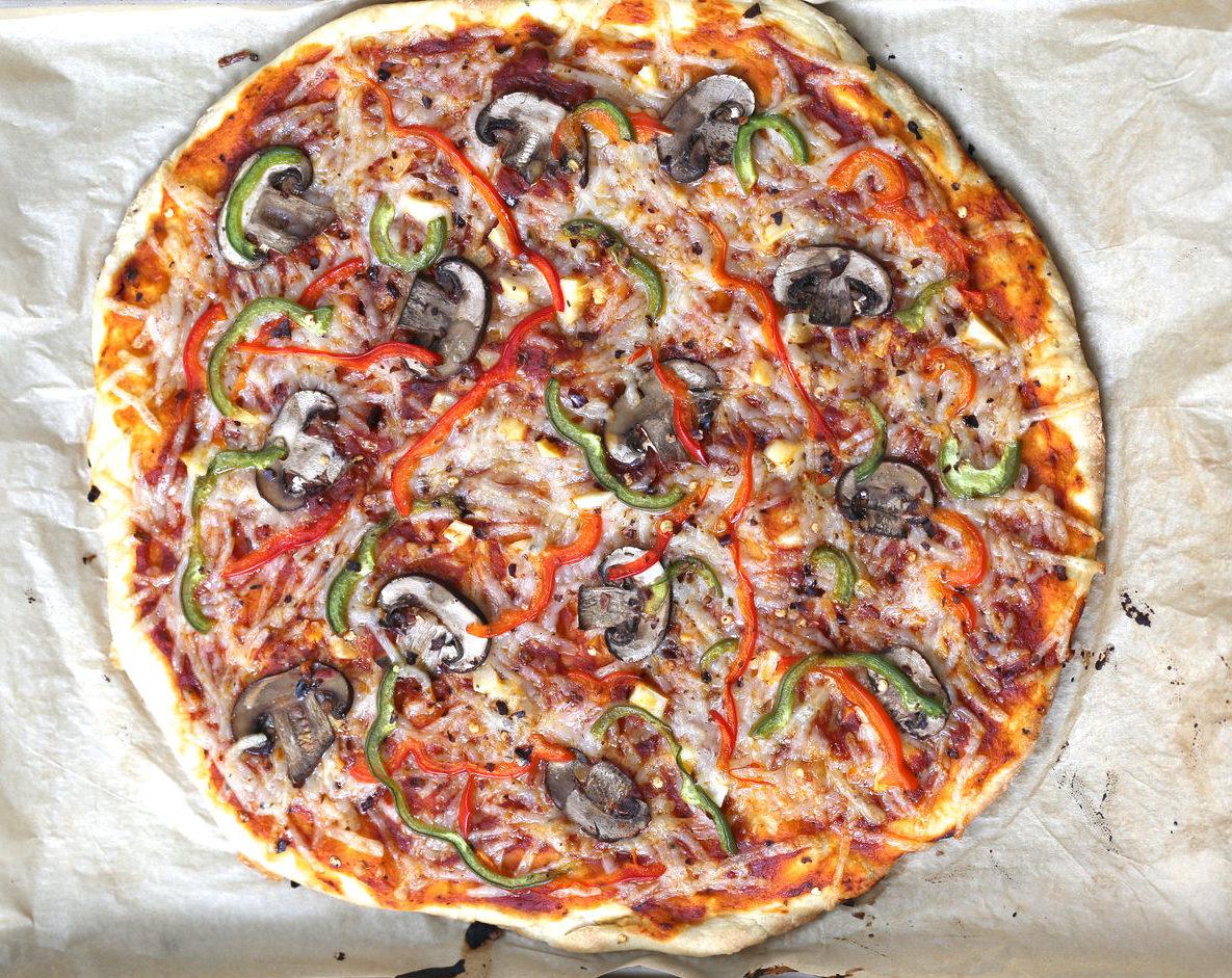 overhead shot of freshly baked vegan pizza made with no yeast