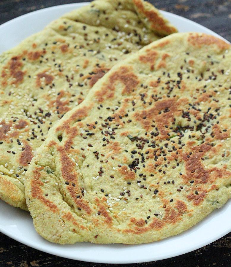 This Oil-free Avocado Naan does not need yogurt. Avocado adds the moisture and fat to keep this flat-bread moist for days. | VeganRicha.com #vegan #flatbread