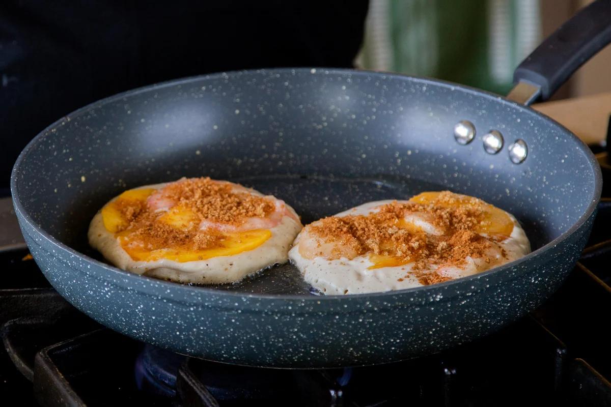 peach pancakes after sprinkling on brown sugar and cinnamon