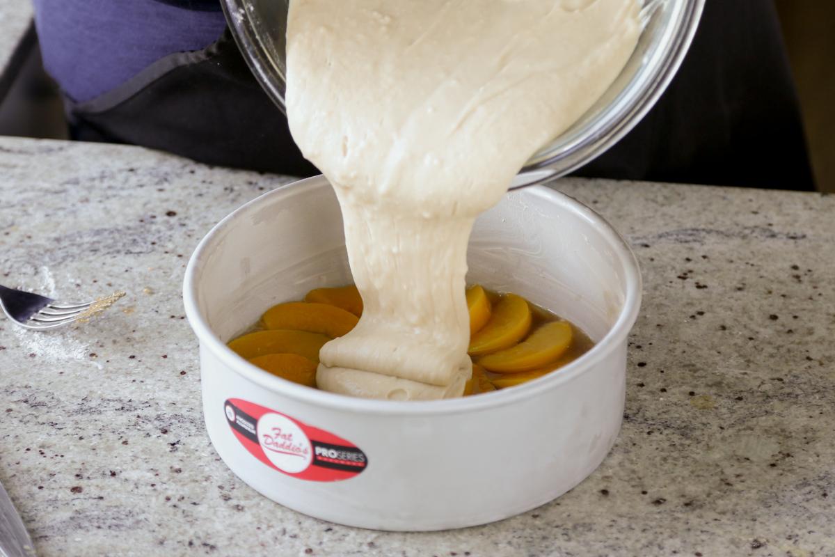 pouring the batter into the cake pan