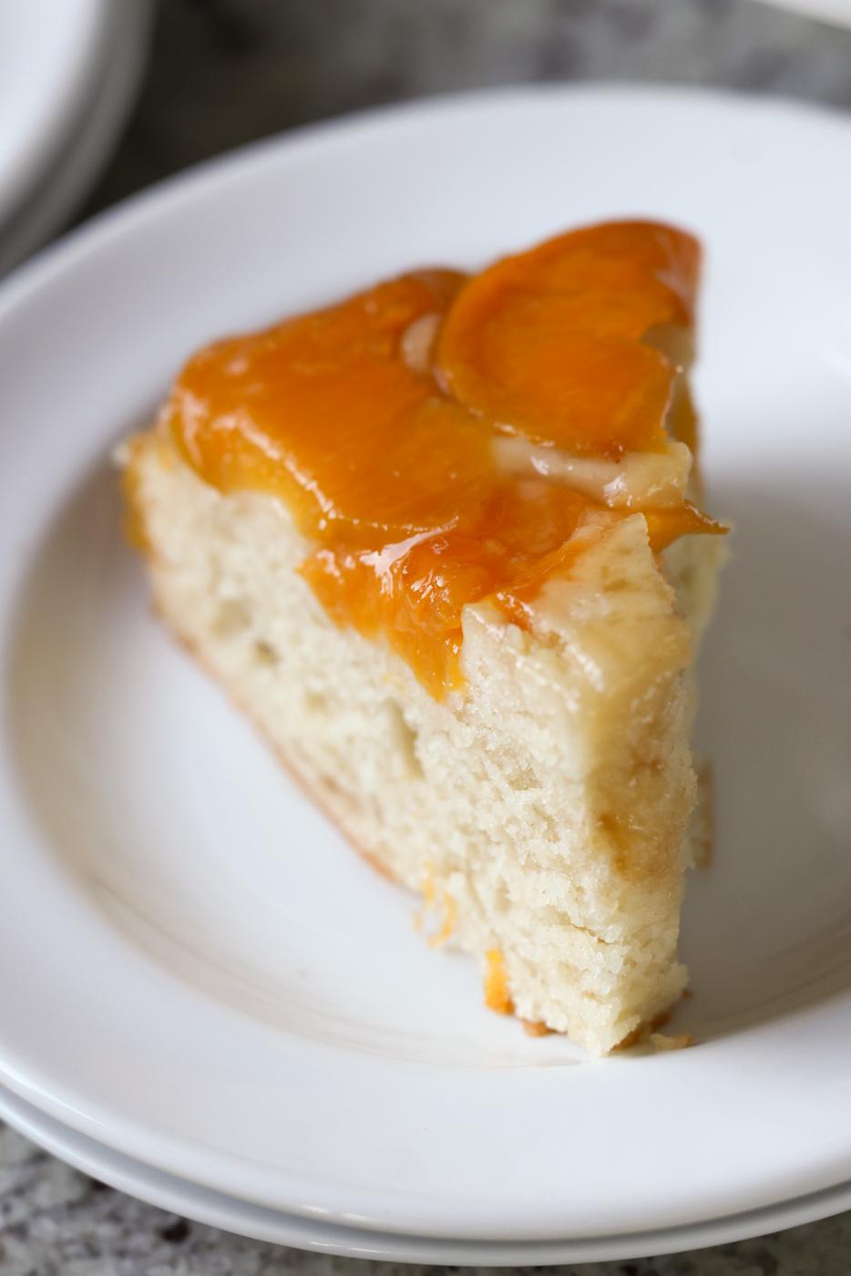 slice of peach upside-down cake on a plate