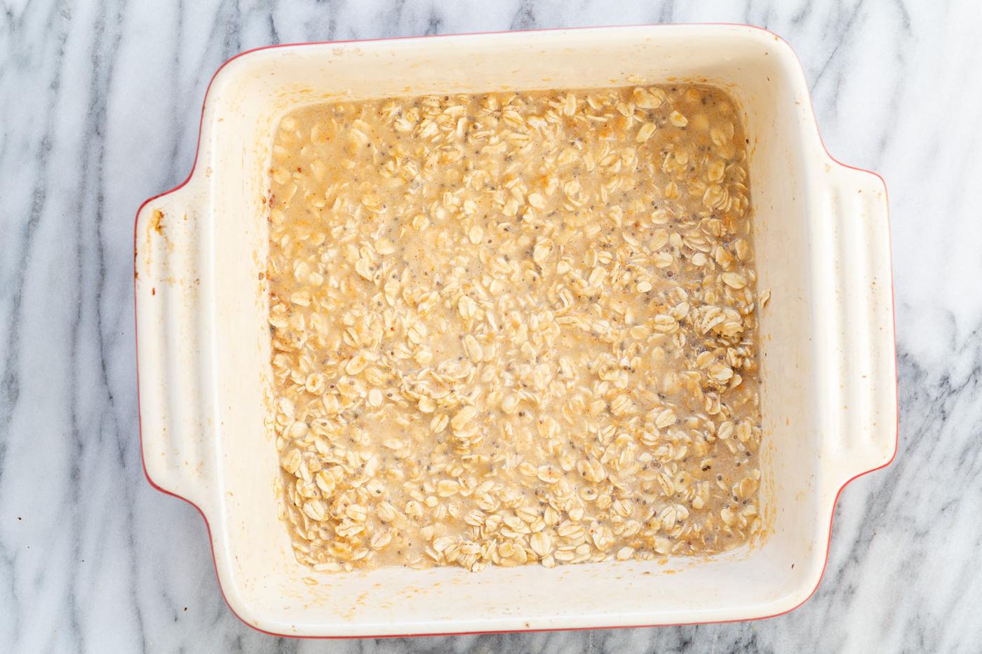 Peanut Butrer And Jelly Oatmeal in a white baking dish