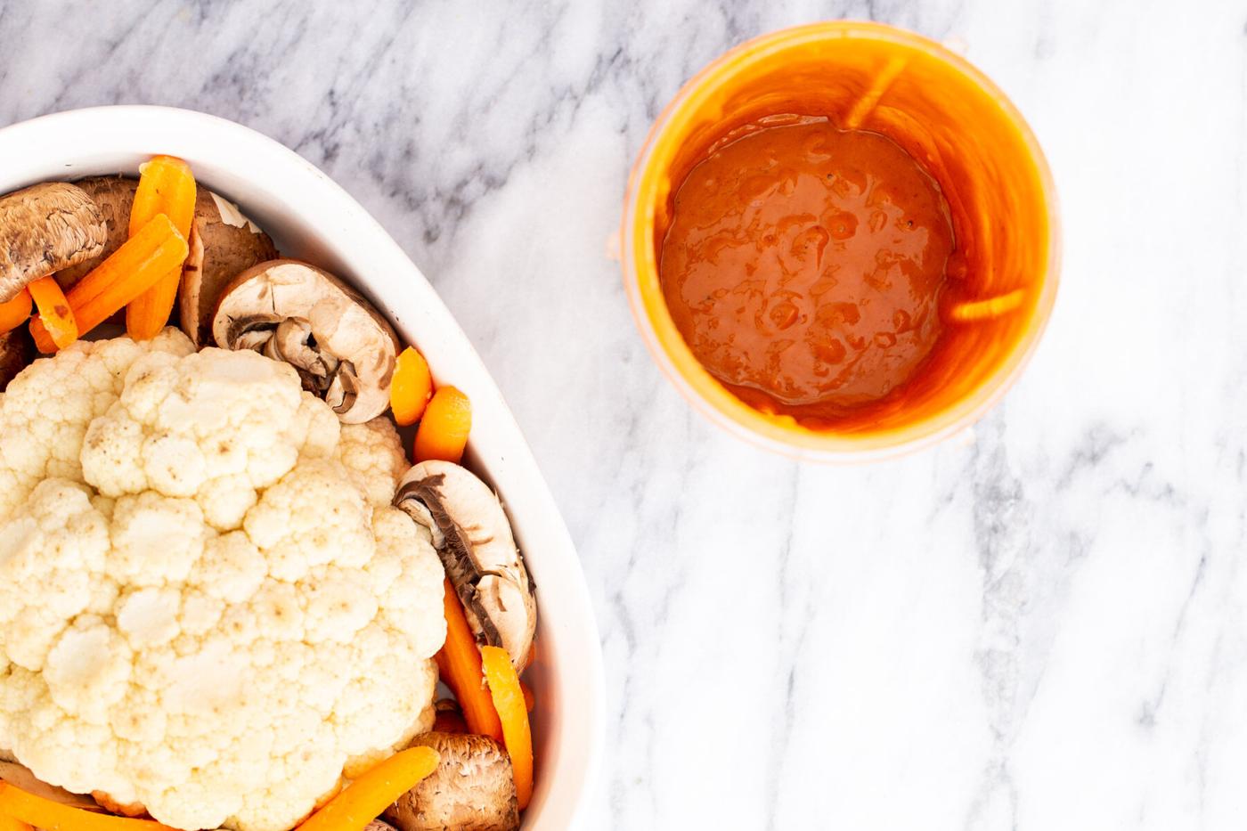 cauliflower and asian peanut butter miso glaze on a white marble countertop