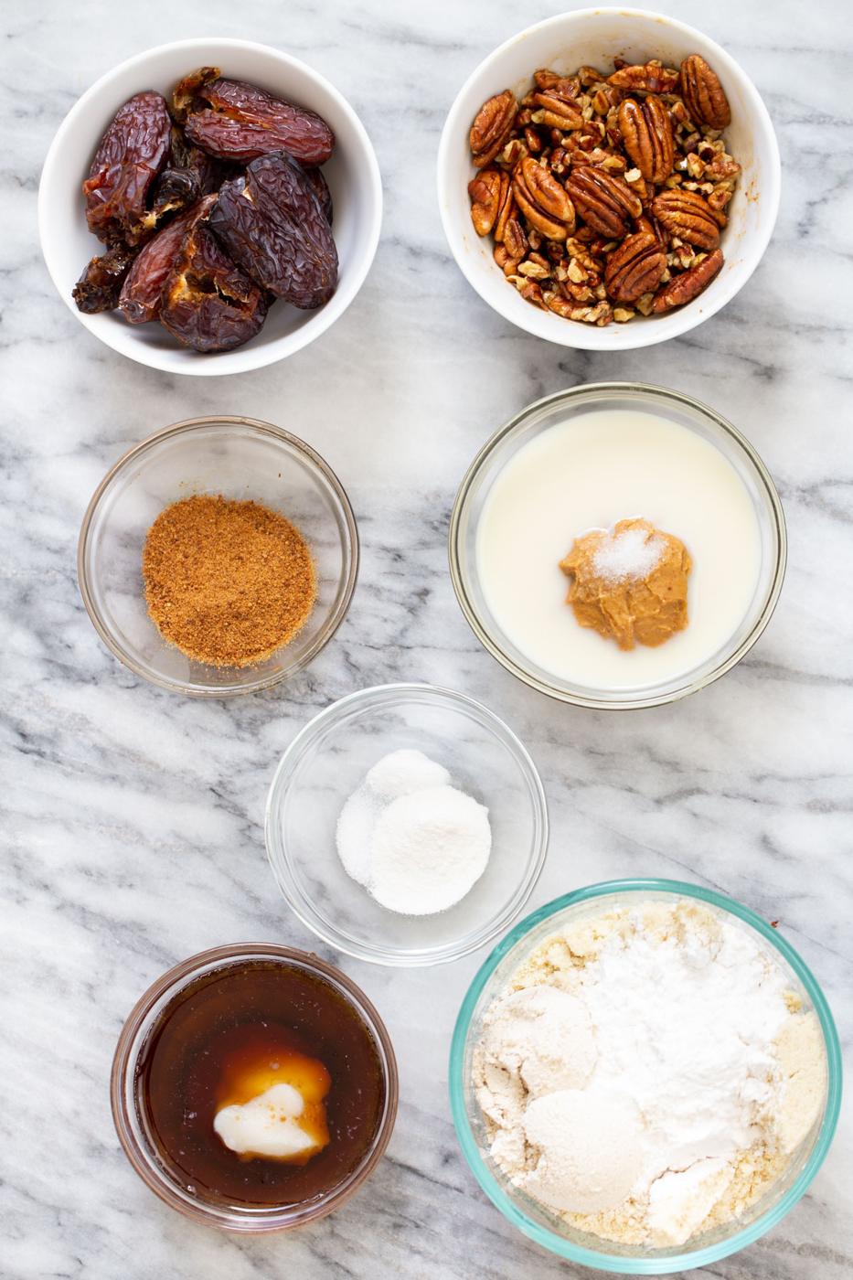 ingredients for vegan pecan pie bars on a marble counter