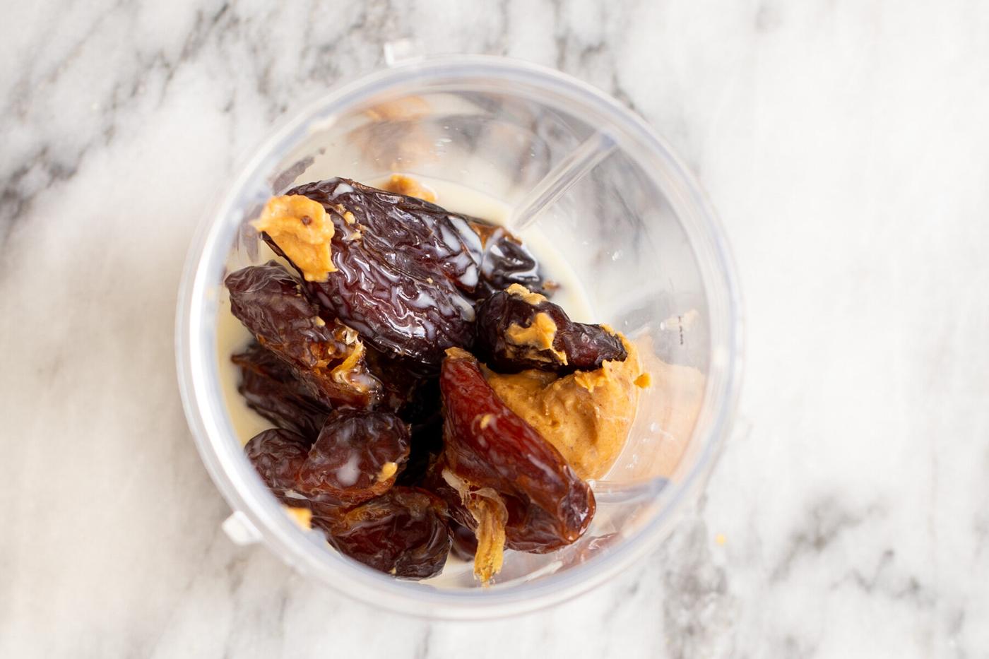 ingredients for date caramel in a blender