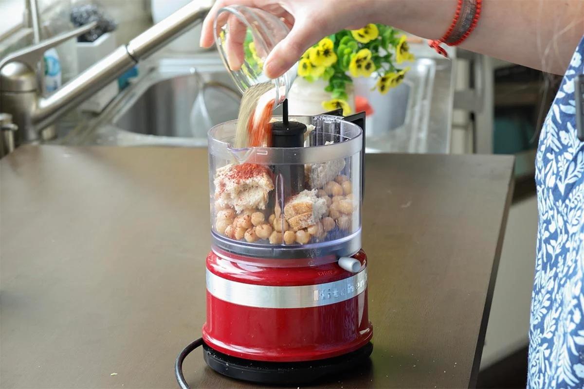 chickpea topping ingredients in the food processor before running it