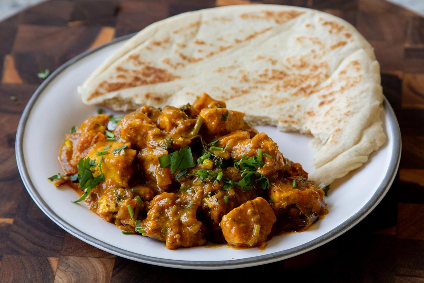 tofu pepper fry on a plate with flatbread