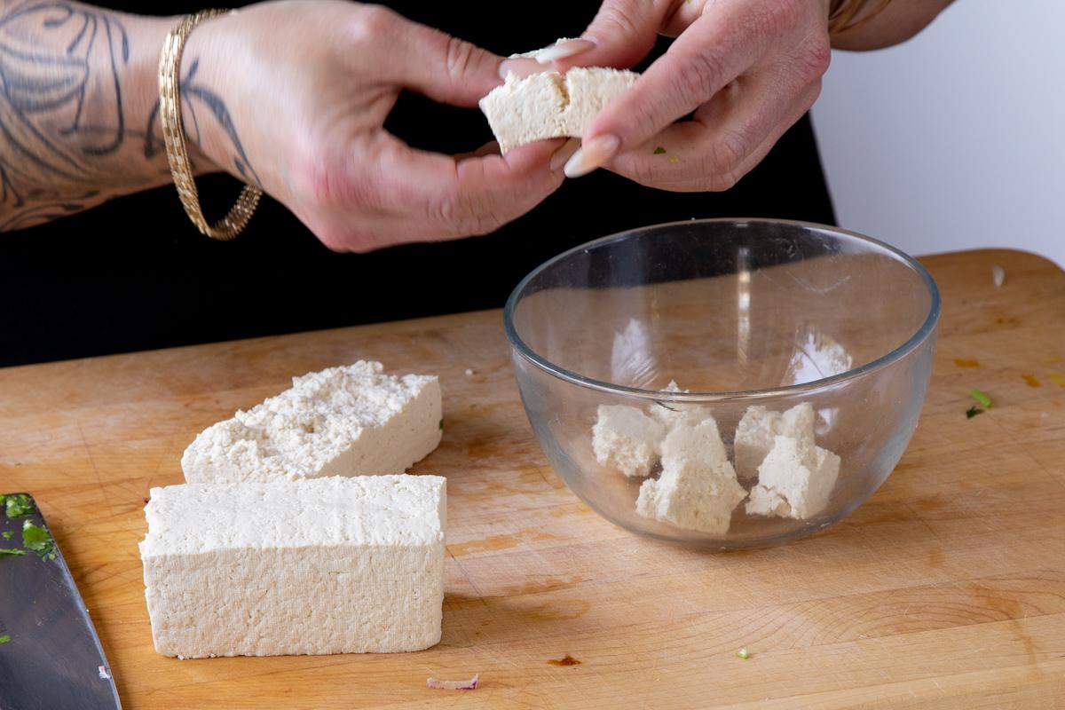 tearing tofu into pieces