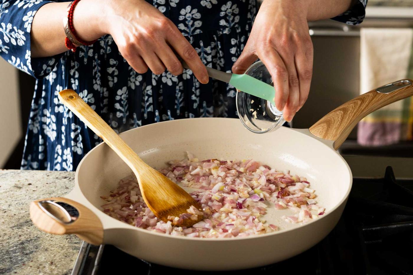 sautéing the onions and garlic in the pan