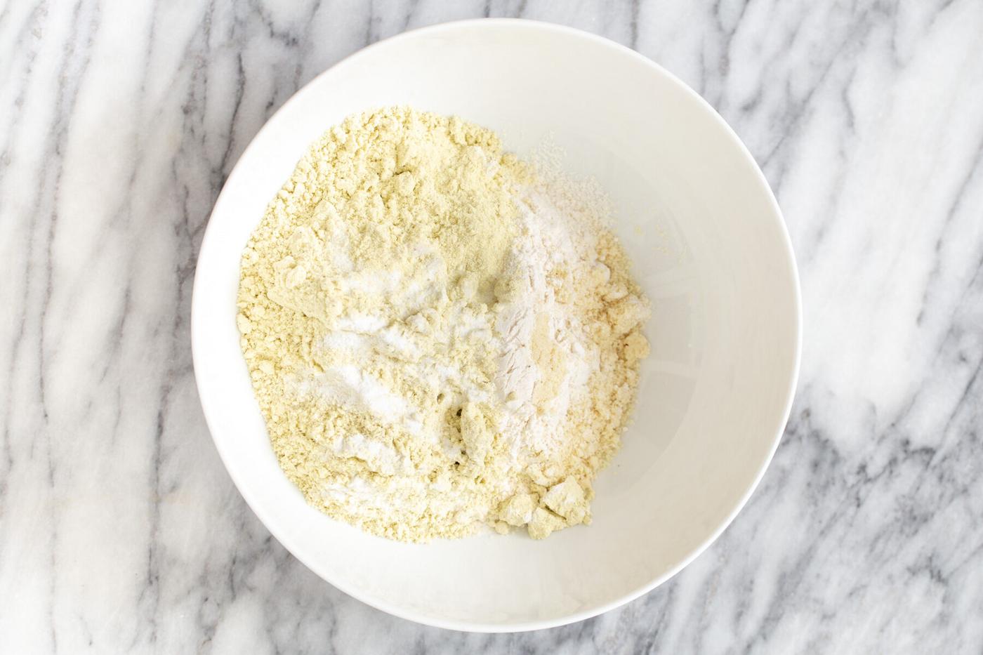 dry mix for vegan pistachio cookies in a white bowl