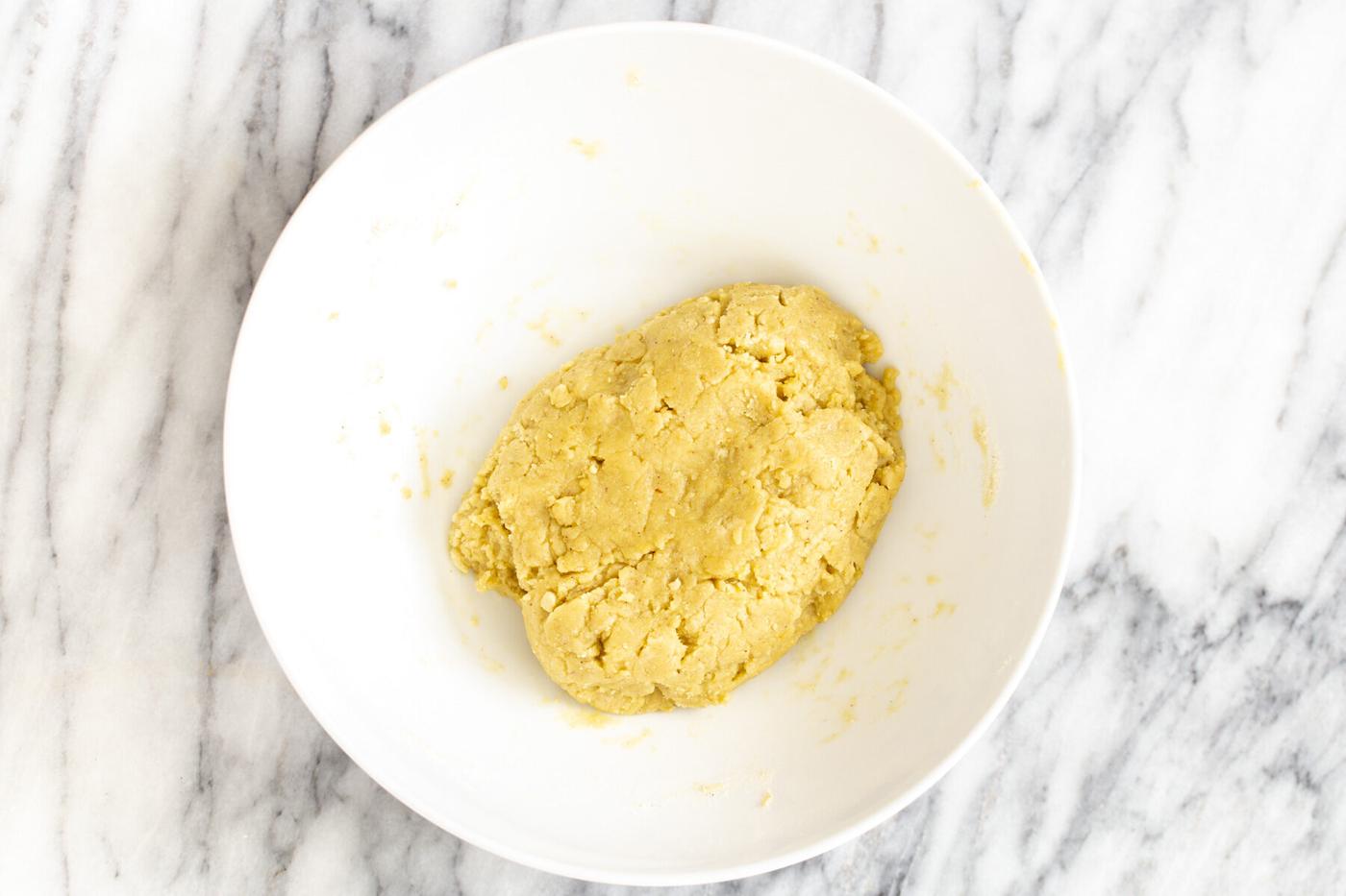 vegan pistachio cookie batter in a white bowl