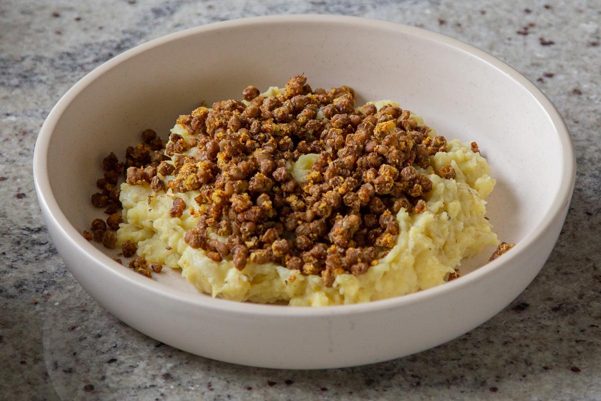potato-cauliflower mash in a bowl with lentils