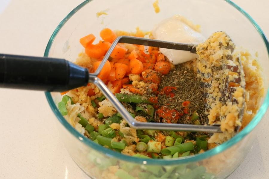 chickpea stuffing ingredients for stuffed portobello mushrooms recipe being mixed in a bowl