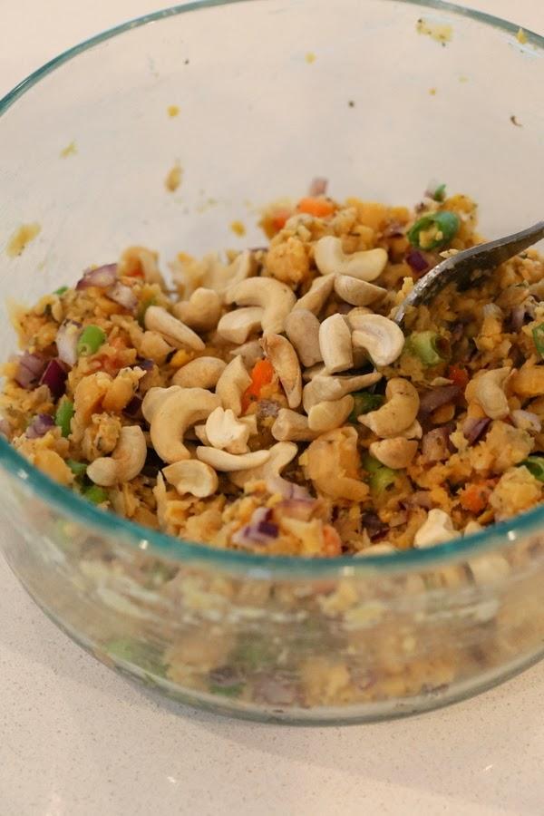 cashews being added to vegan filling for making stuffed portobello mushrooms recipe