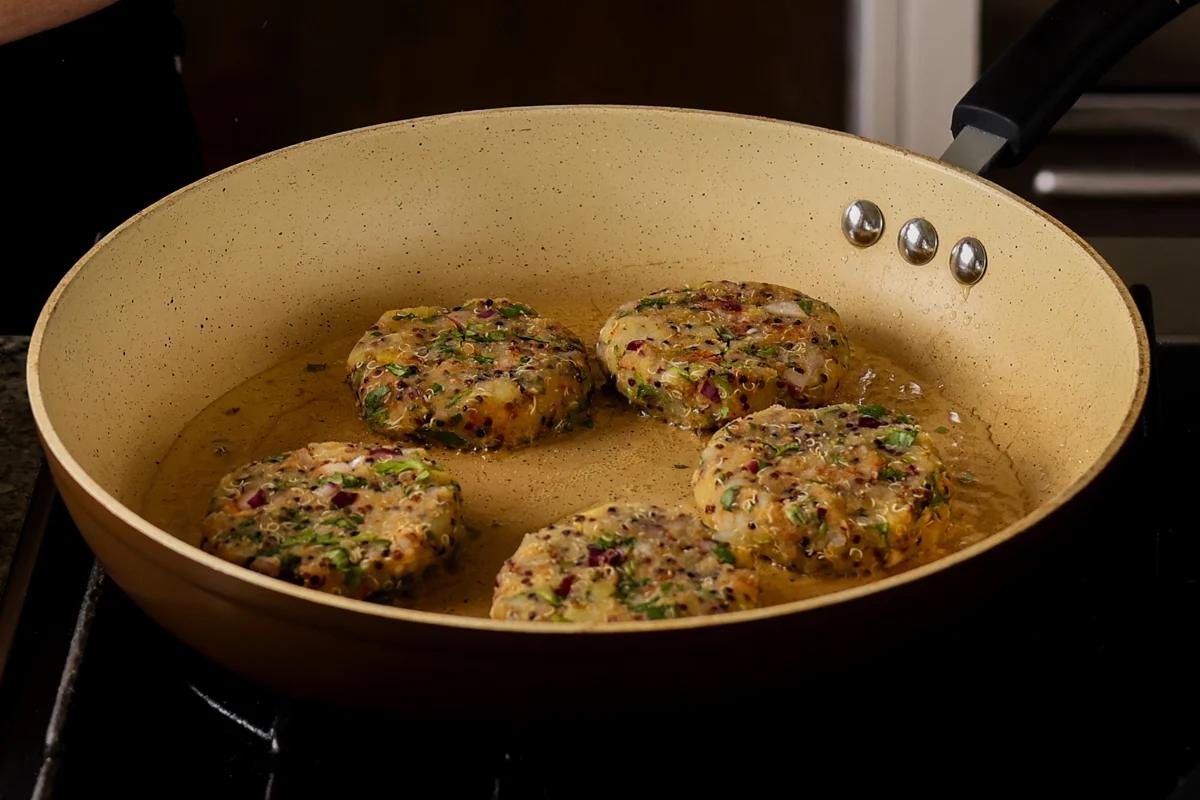 frying the tikkis in the pan