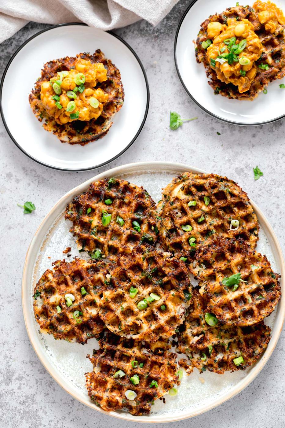 overhead shot of vegan potato quinoa waffles sprinkled with chopped chives