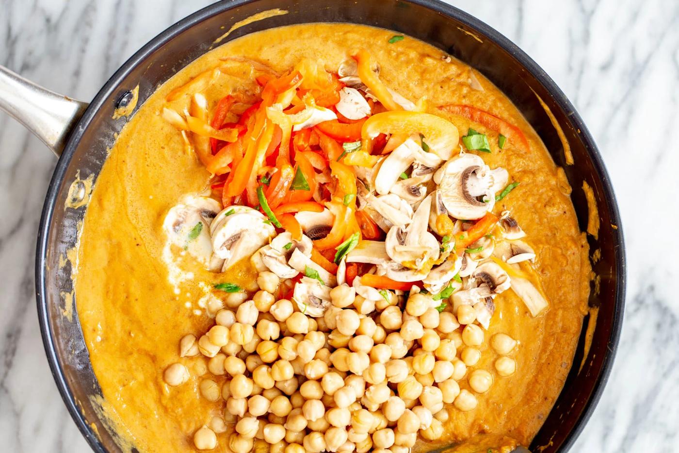 veggies being added to pumpkin curry base