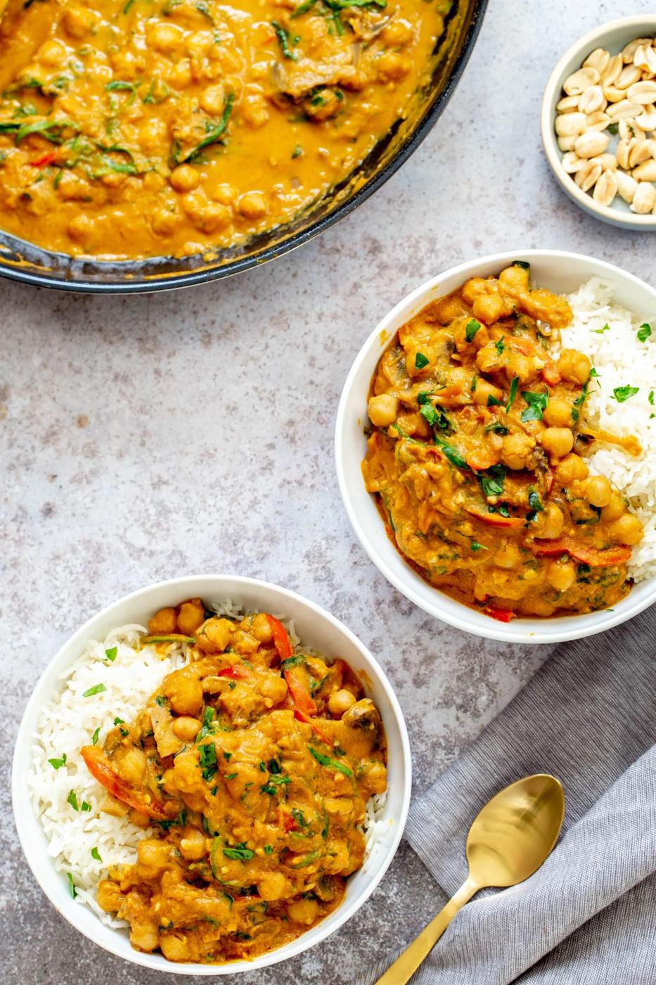 two servings of vegan one pot chickpea pumpkin curry served with rice