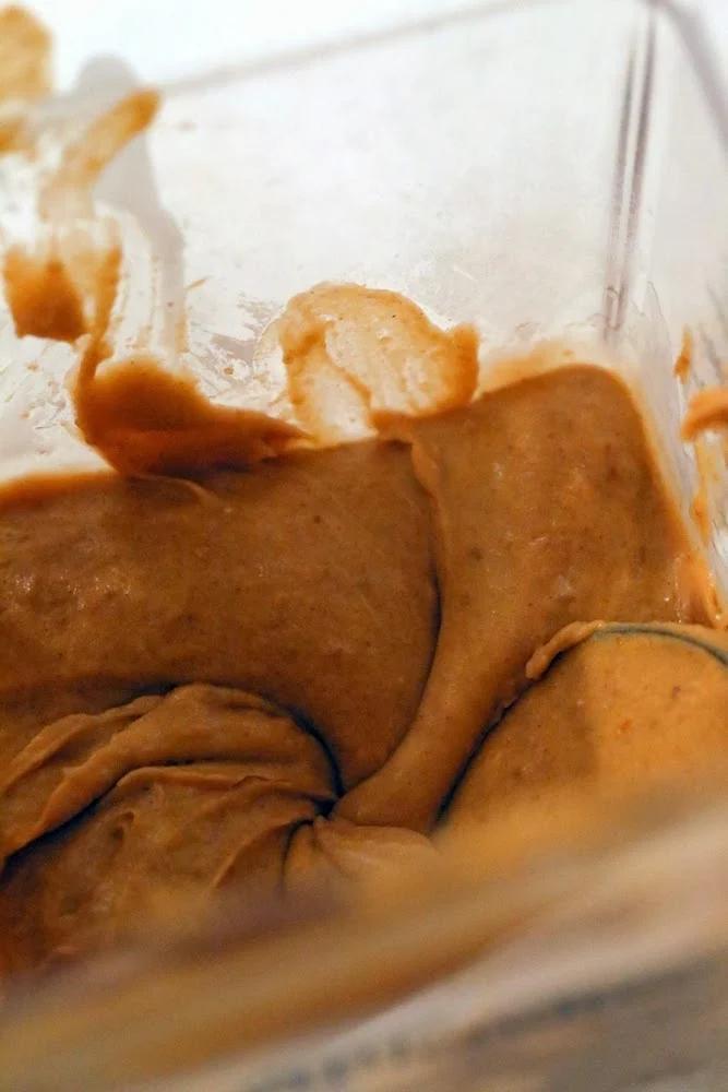 pumpkin mousse for vegan cake recipe being blended until smooth in a blender