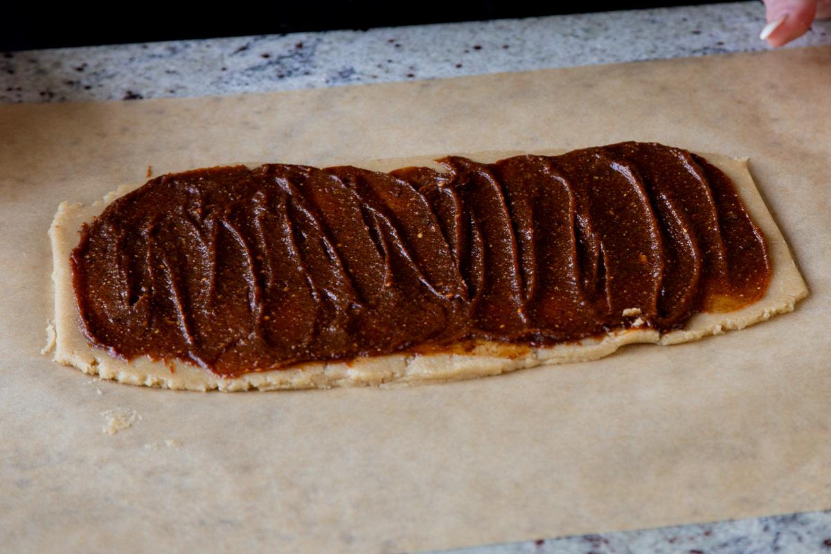 pumpkin pie spice mixture all spread out on the almond flour cookie dough
