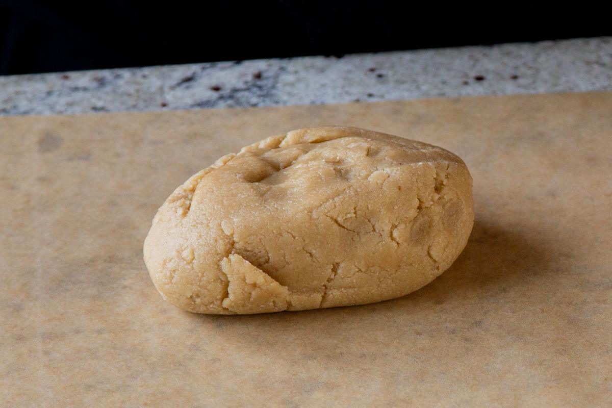 almond flour cookie dough on a parchment sheet