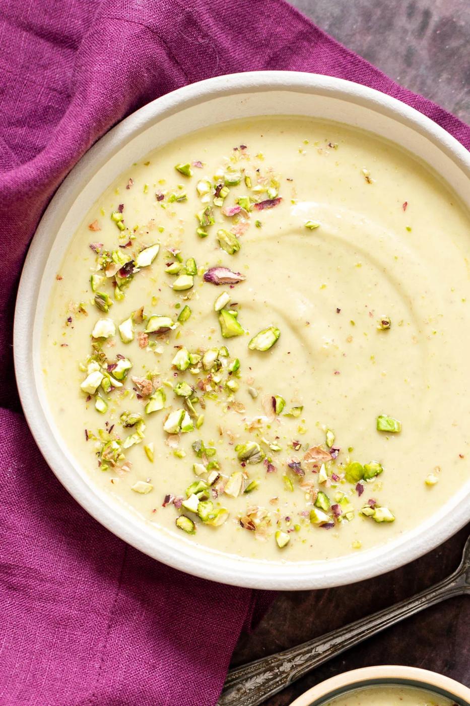 a bowl of Indian Rabri Pudding topped with chopped pistachios