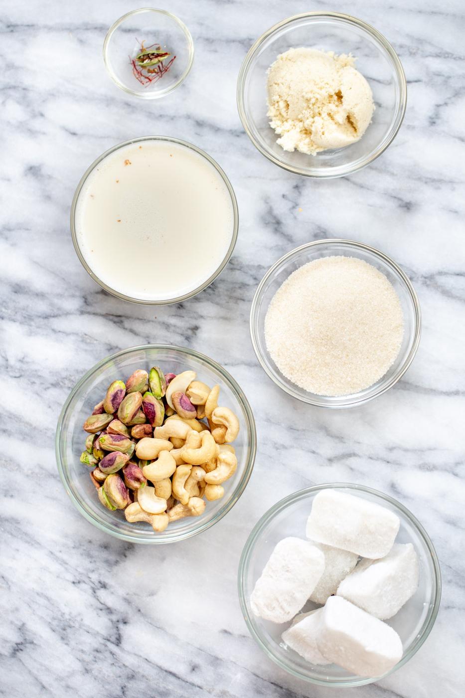 Ingredients for Indian milk pudding rabri in bowls