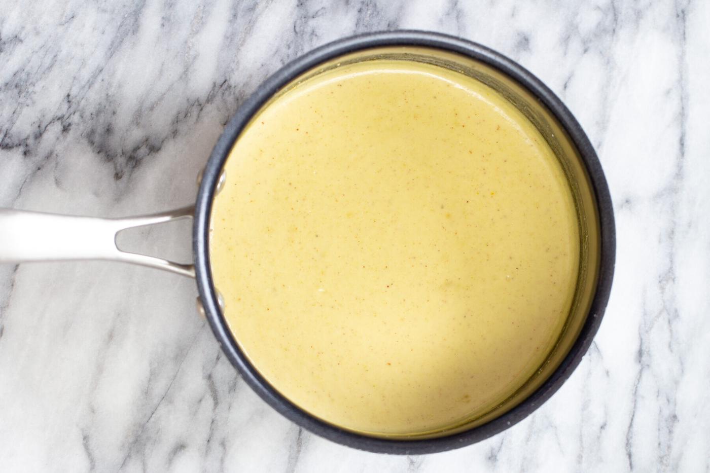 nut milk thickened with almond flour in a saucepan