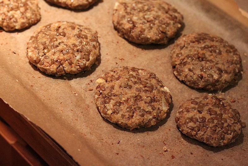 raw lentil cauliflower patties on parchment paper