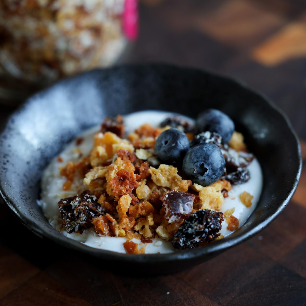 bowl of yogurt topped with red lentil granola
