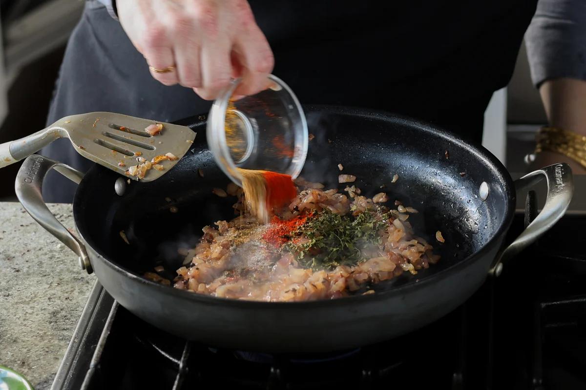 adding ground spices to the pan