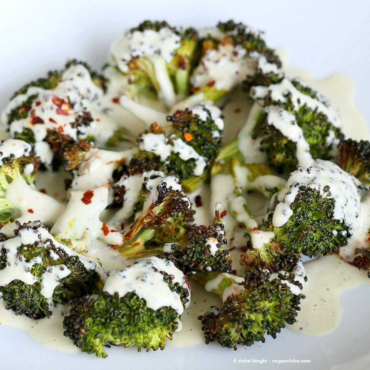 Roasted Broccoli with Creamy Basil Dressing. Broccoli tossed in garlic, cayenne, and baked. Served with cheesy cashew basil sauce. Vegan Glutenfree soyfree Recipe | VeganRicha.com