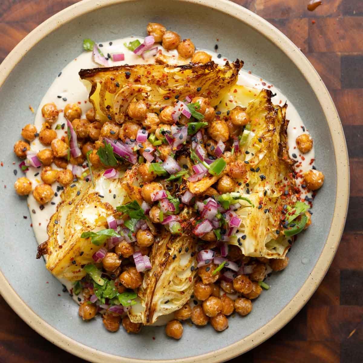 Roasted Cabbage with Garlic Lemon Chickpeas, Tahini Sauce, and Jalapeño Gremolata