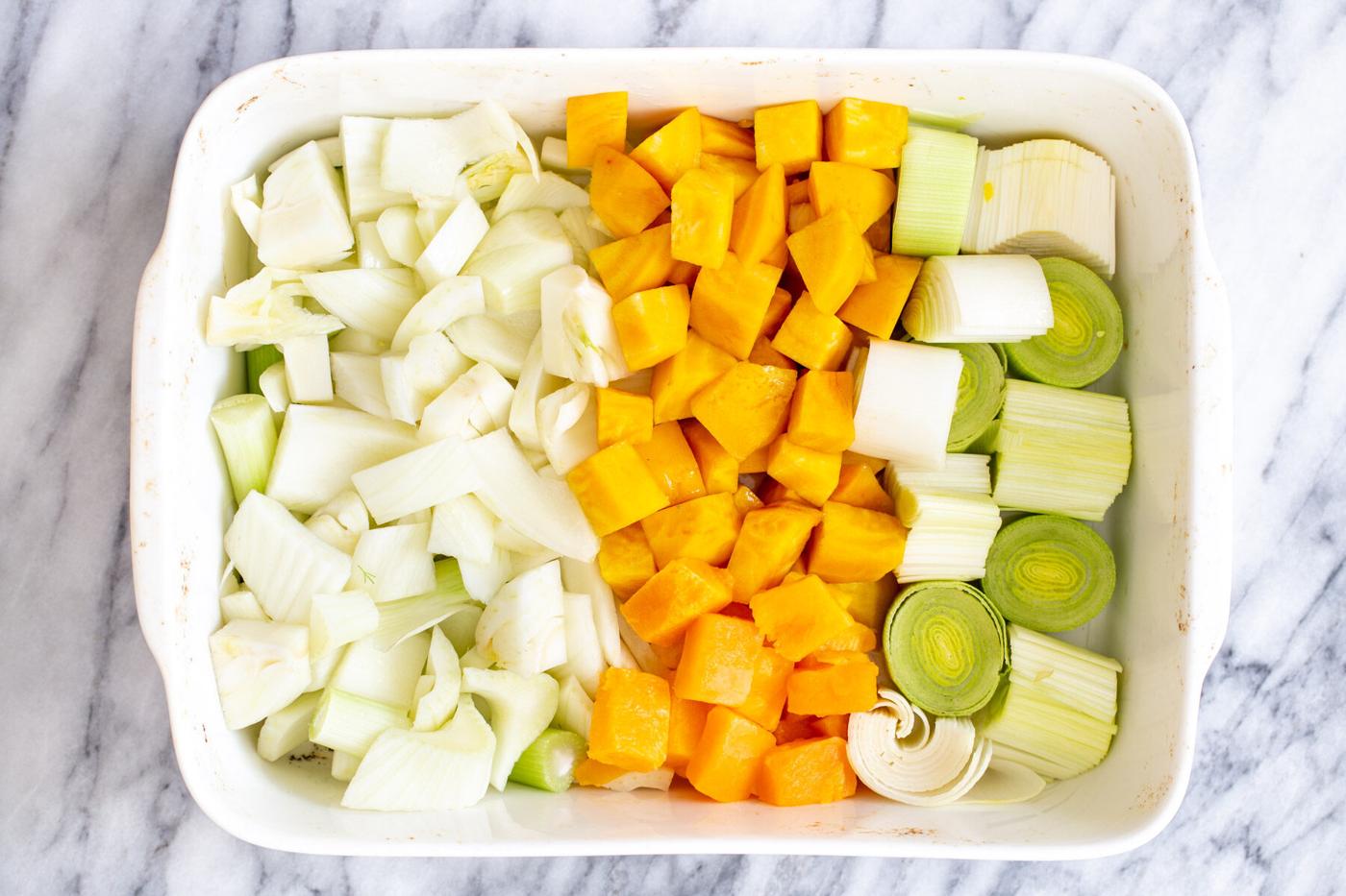 chopped root vegtetables in a casserole dish