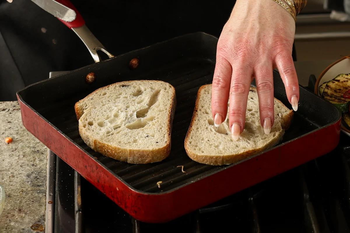 toasting the bread on the grill pan