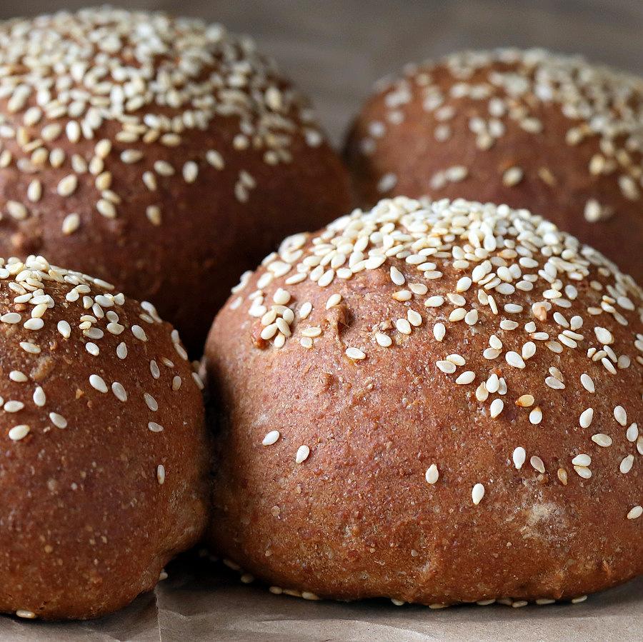 side view close-up of Rye Almond Flour Vegan Burger buns sprinkled with sesame seeds