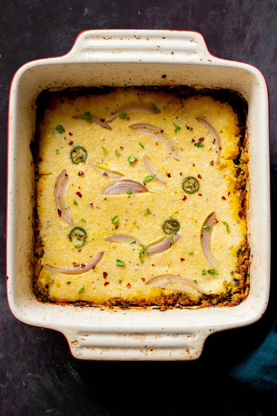 overhead shot of a casserole dish with vegan saag cornbread casserole