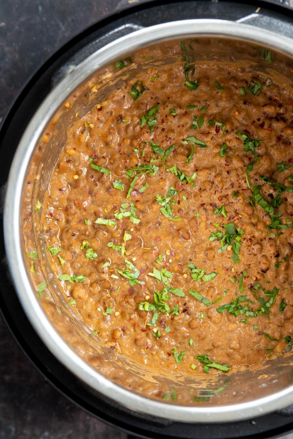 creamy green mung beans dal in an Instant pot sprinkled with cilantro