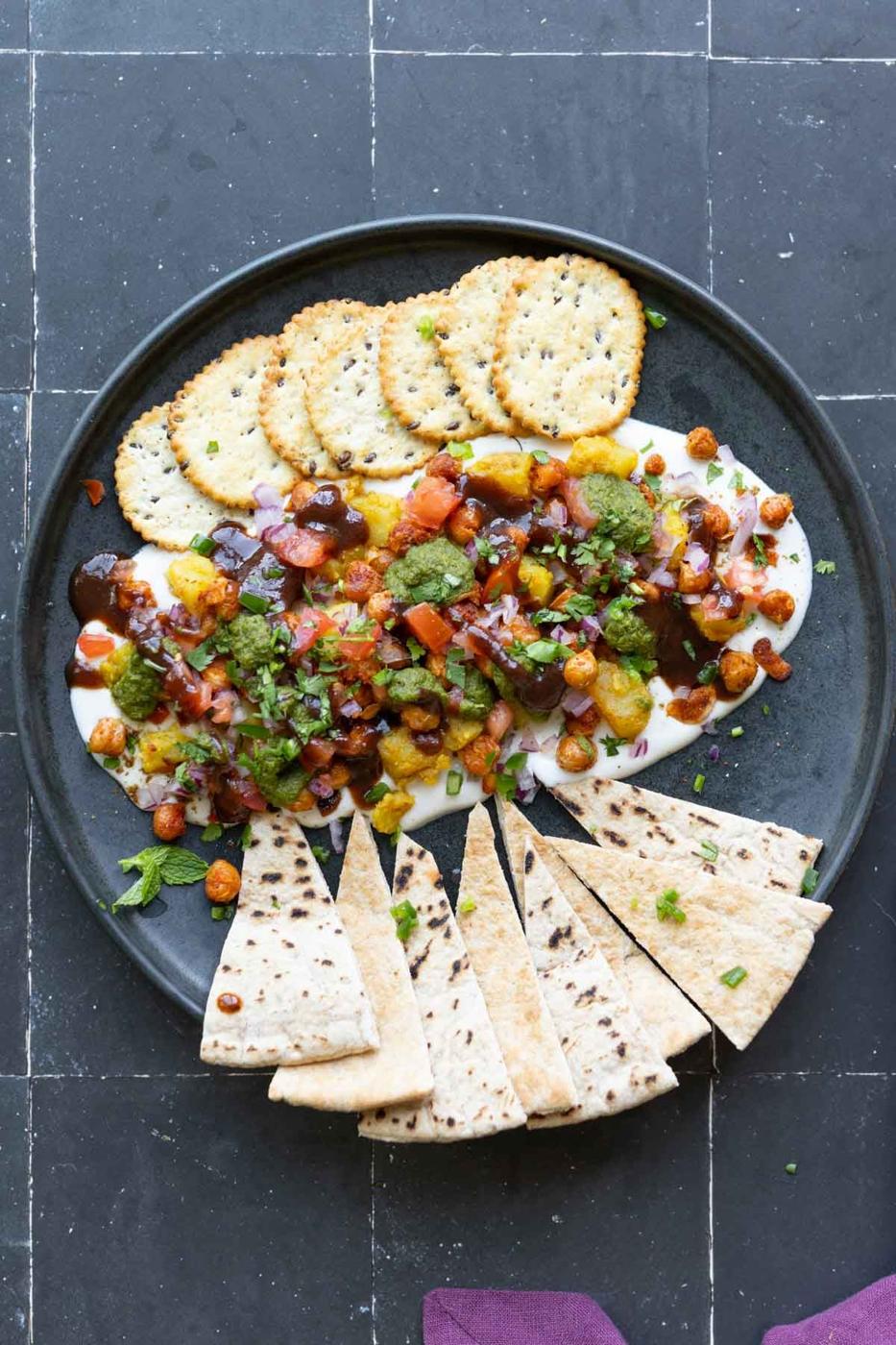 samosa platter with crackers and pita triangles
