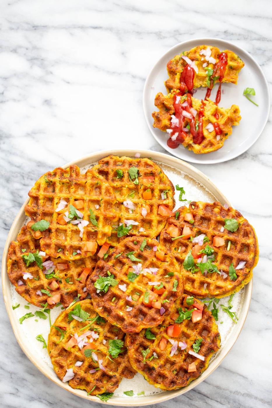 overhead shot of a plate with crispy vegan chickpea flour waffles with vegetables