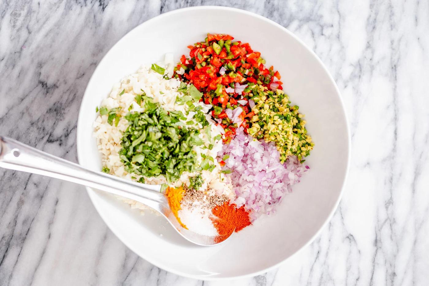 ingredients for pakora waffles in a white bowl